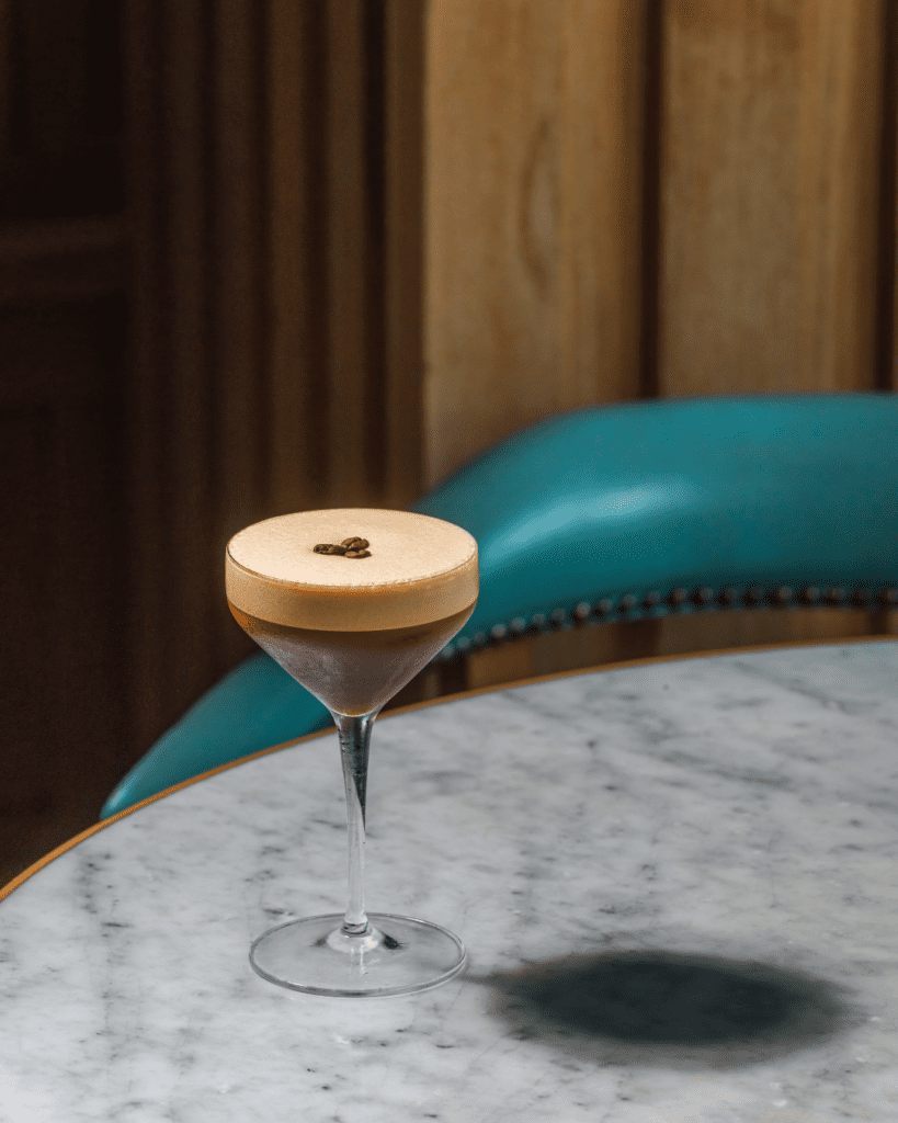 Espresso martini cocktail on a table.