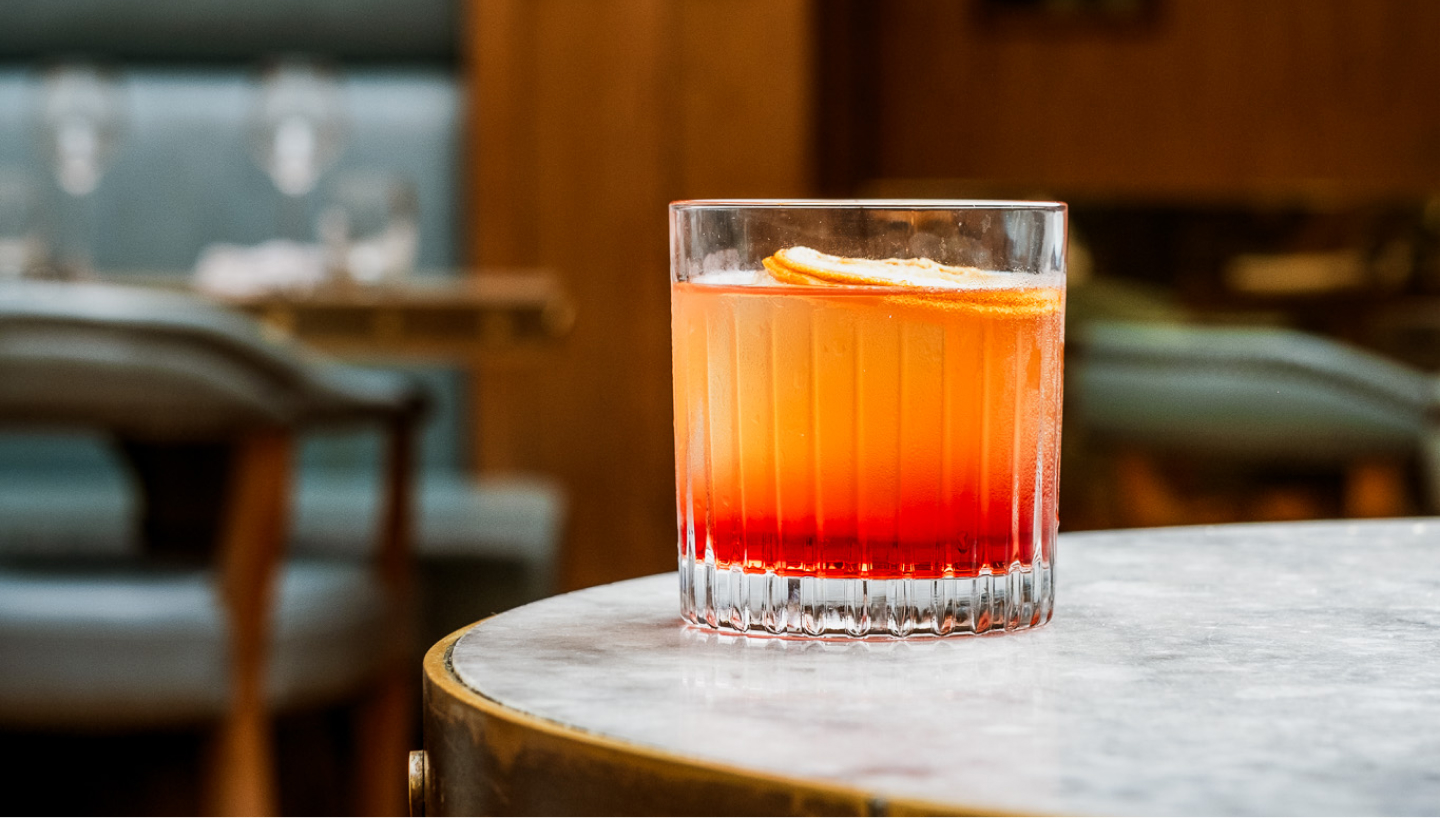 Negroni cocktail on round table.